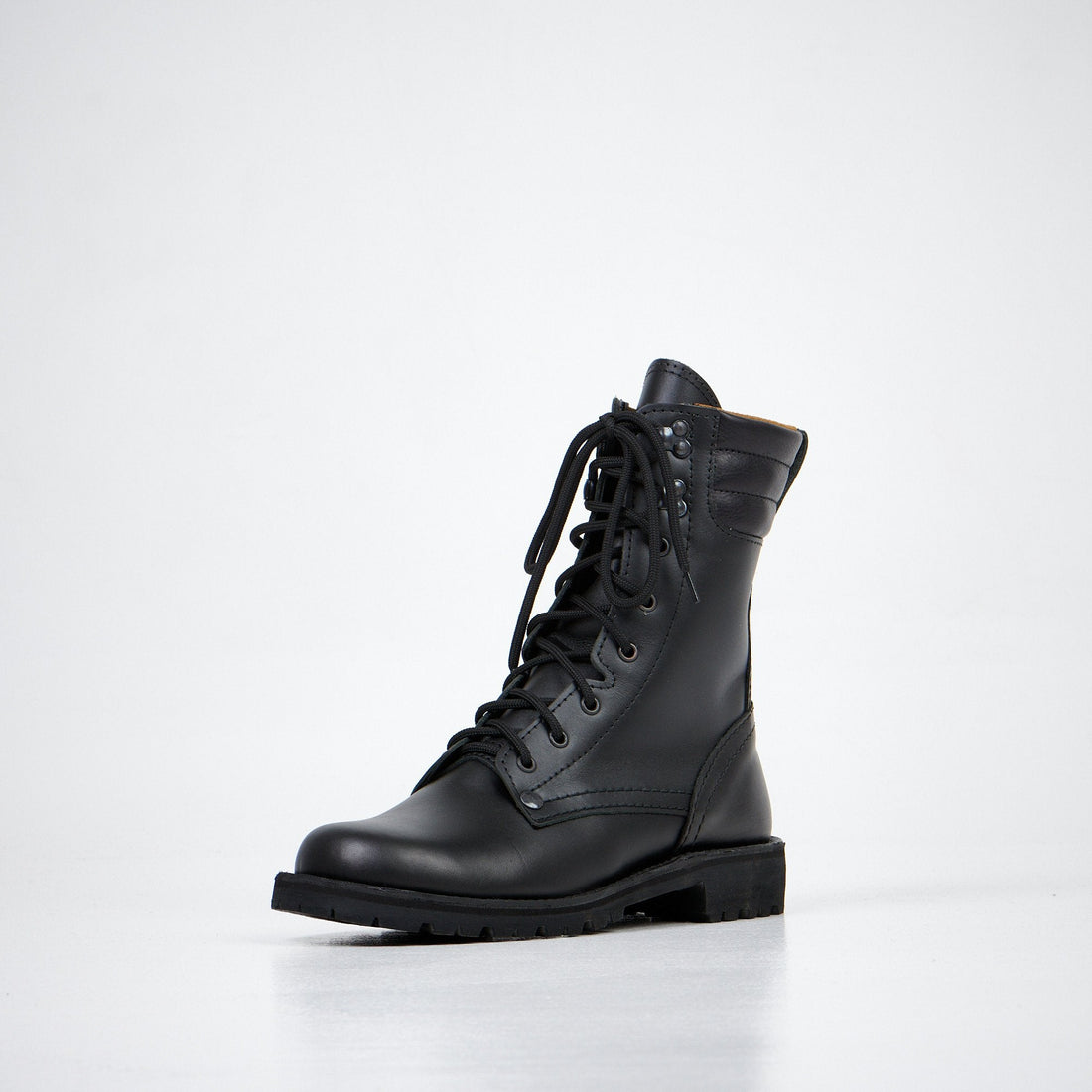 1. Aipi AIPI-1 handmade leather boots in black, shown in a studio setting with side view highlighting durable rubber sole and lace-up design