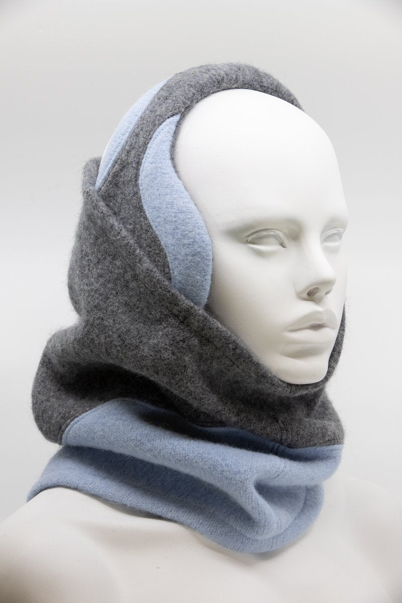 1. Women's felted wool earmuffs in medium grey and light blue by HERTTA, worn by a mannequin in a studio setting