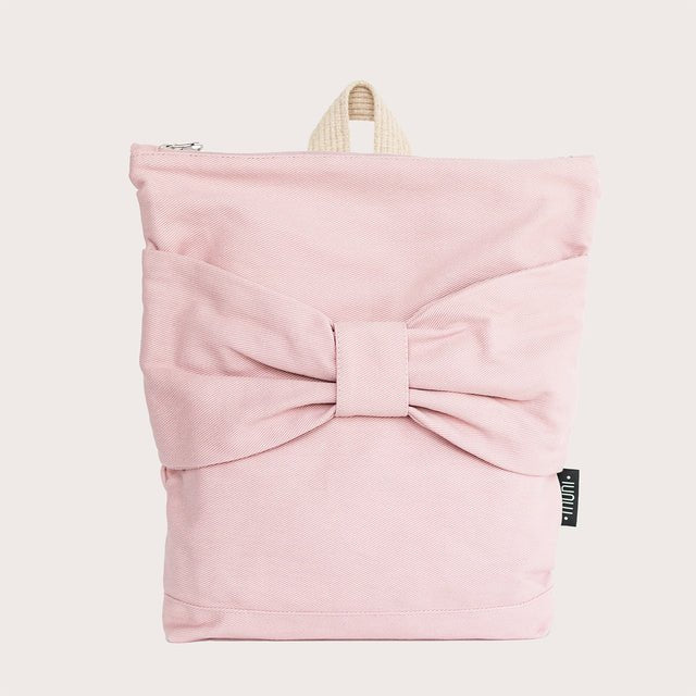 2. Front view of Muni pink bow kids backpack in studio