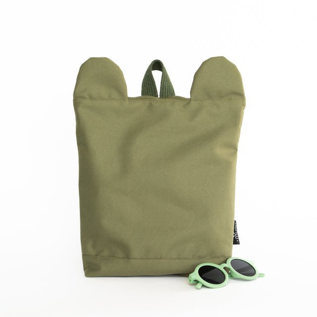 5. Front view of Muni Green Bear Backpack in studio, highlighting bear ear design