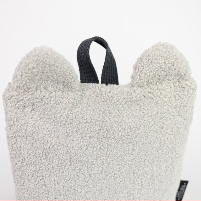 7. Close-up of Muni grey teddy backpack, focusing on the soft texture and teddy bear ears