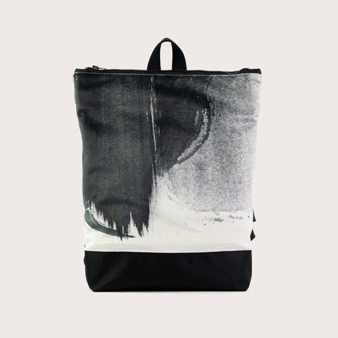 4. Muni Black Watercolor backpack in studio, highlighting watercolor design