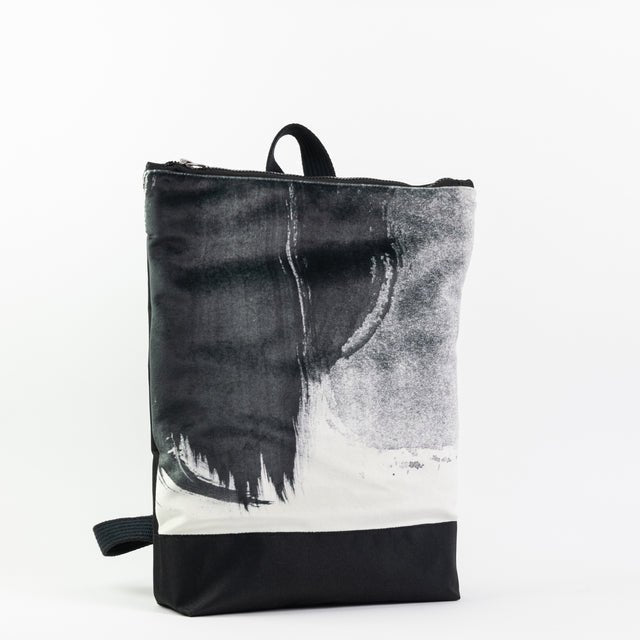 5. Muni Black Watercolor backpack with flowers, showing artistic design