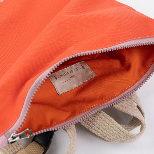 4. Close-up of Muni backpack interior, showing orange lining and label detail