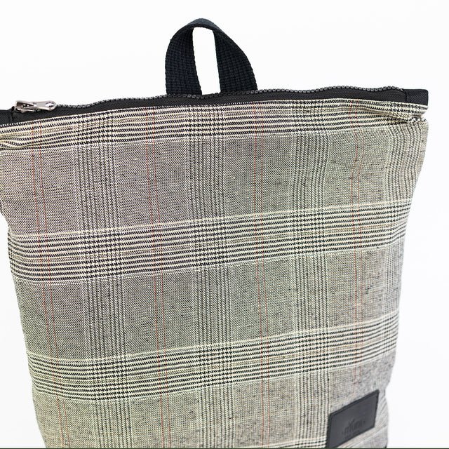 6. Close-up of top part of MUNI Tartan Backpack, highlighting rough linen fabric
