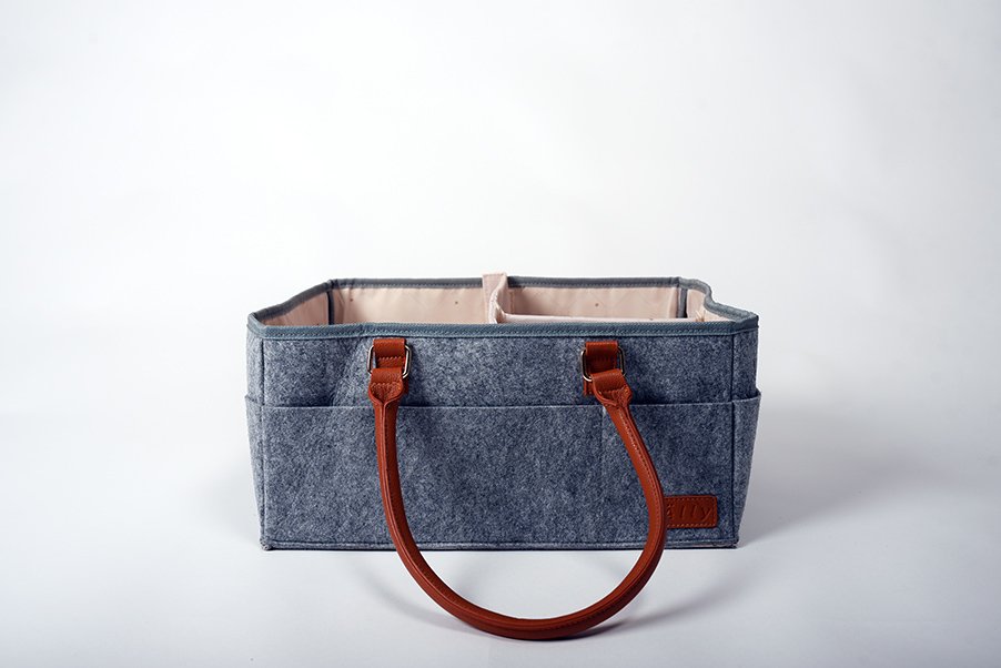 6. Studio shot of Ally Scandic diaper caddy organizer with brown handles, showcasing brand logo