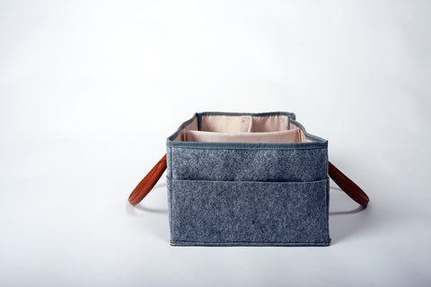 5. Side view of Ally Scandic storage basket in felt and PU leather, highlighting exterior pockets