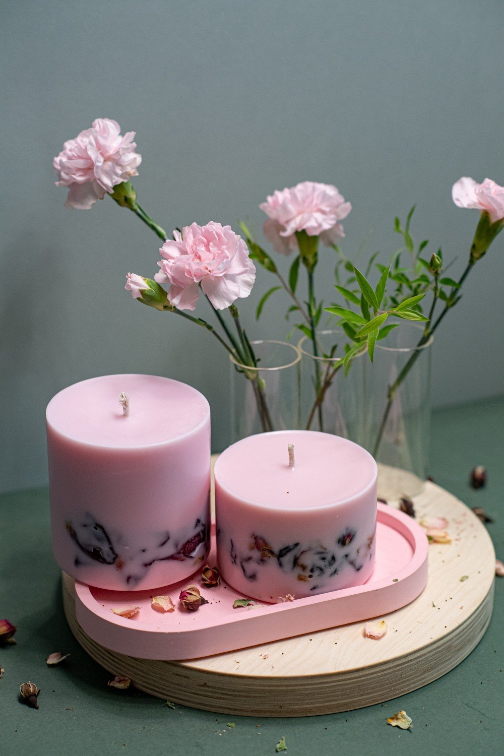 1. Hand-made soy wax candles with peony scent by TL Candles, shown with flower petals in a lifestyle setting