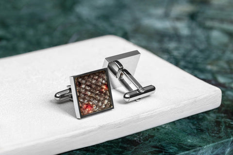 2. Pair of Eherüs square cufflinks featuring unique red-spotted brown trout leather pattern on white surface