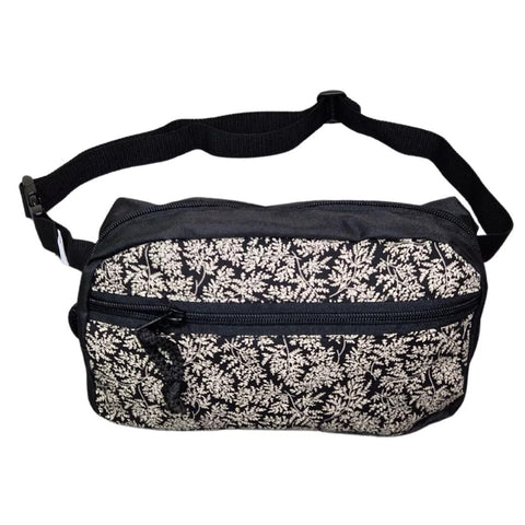 2. Drinbags FERN dog treat bag in black with white floral pattern, shown in studio