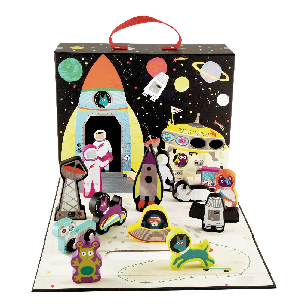 1. Space-themed playbox with wooden pieces including astronauts, rockets, and aliens, set against a starry background with planets and a space station