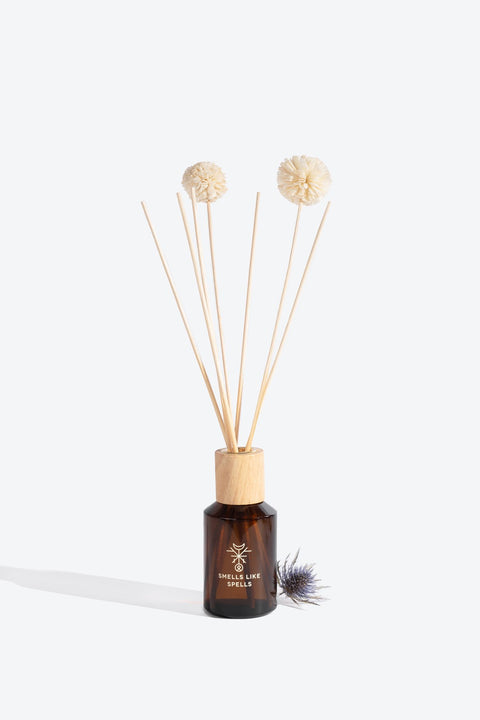 4. Smells Like Spells HEIMDALLR home perfume in brown glass bottle with reed diffuser sticks, close-up view