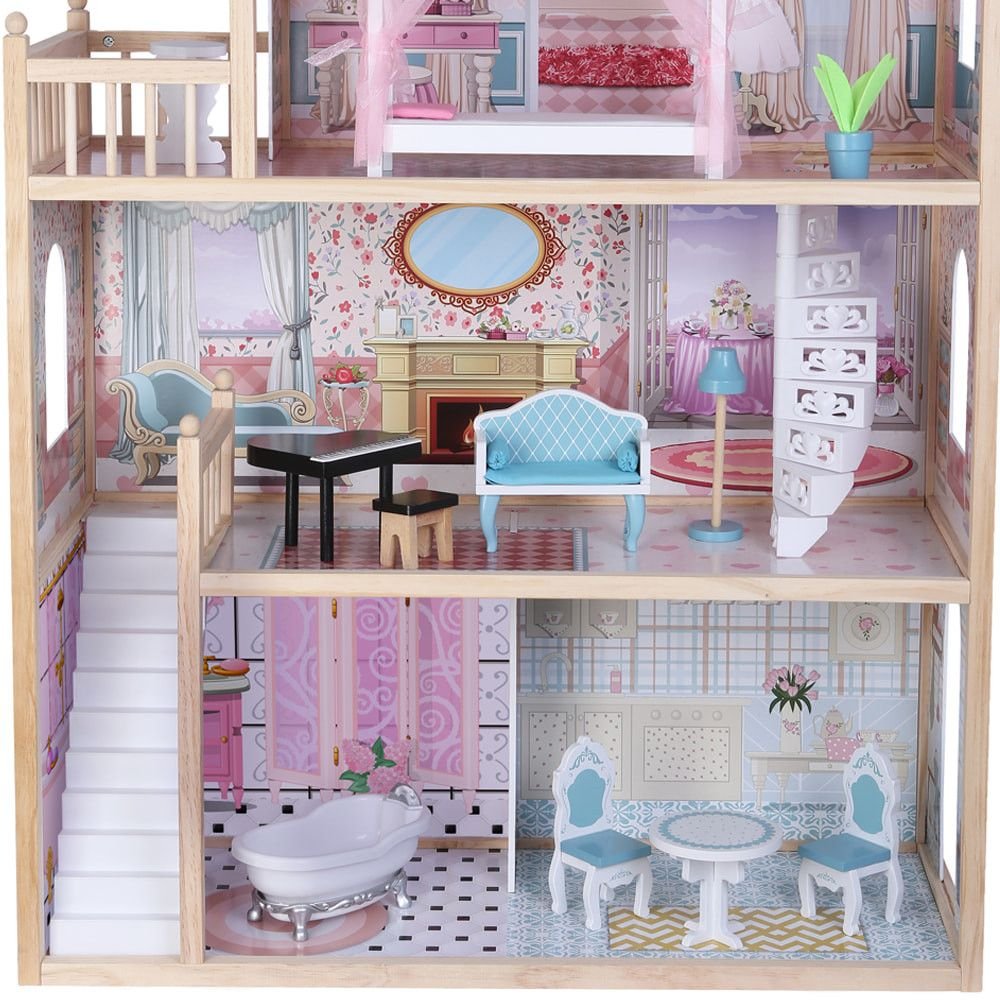 3. Close-up of the dollhouse's second and third floors showing spiral staircase and floral wallpaper
