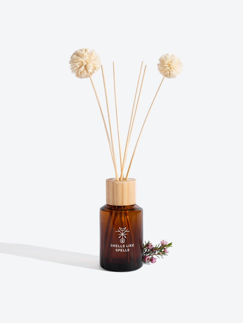 2. Smells Like Spells Home Perfume DELLINGR with diffuser sticks and floral accent, studio setting