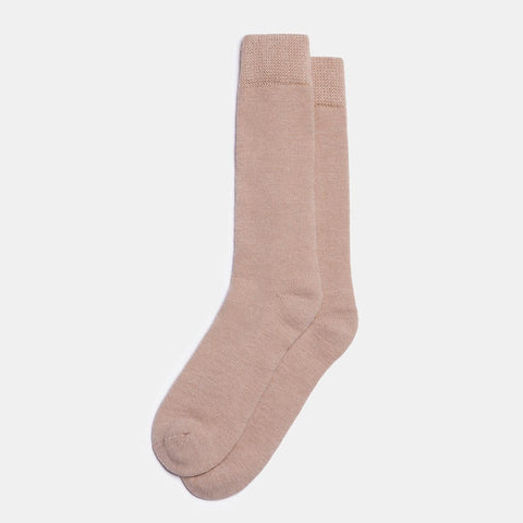 2. Unisex beige Alpaka natural alpaca wool socks in studio setting, highlighting thick knit and durable design