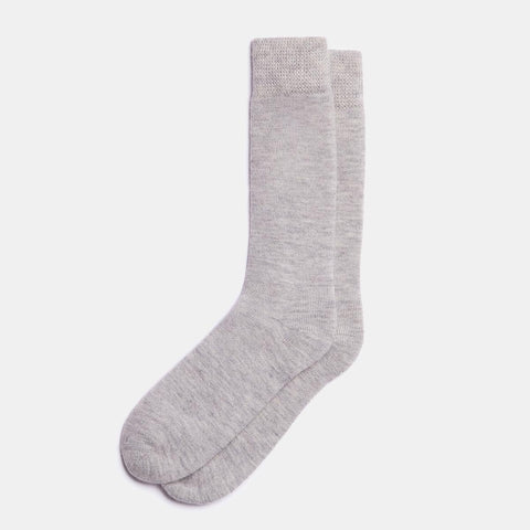 1. Unisex silver Alpaka natural alpaca wool socks in studio setting, showcasing fine knit and reinforced heel and toe