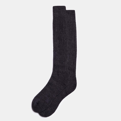 2. Unisex long alpaca wool socks in charcoal, showcasing ribbed texture, displayed in studio