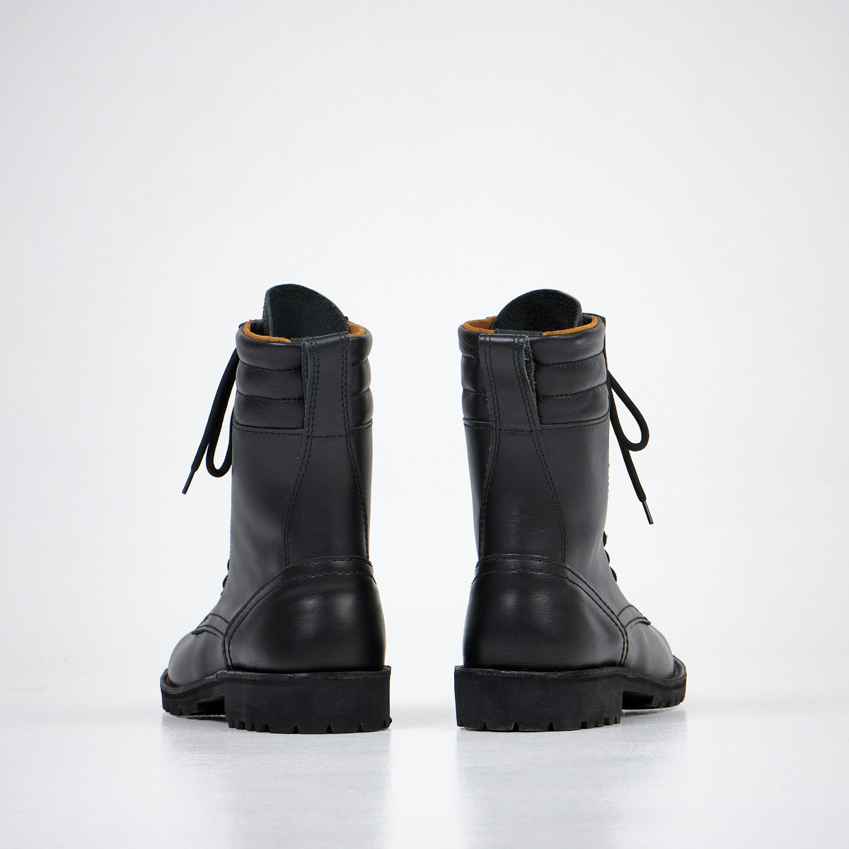 4. Back view of Aipi AIPI-1 handmade leather boots in black, highlighting craftsmanship and rubber sole