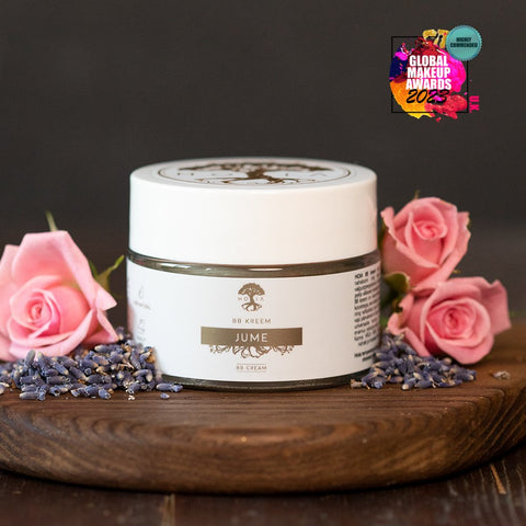 2. HOIA homespa BB Cream jar with Global Makeup Awards 2023 badge, surrounded by pink roses and lavender