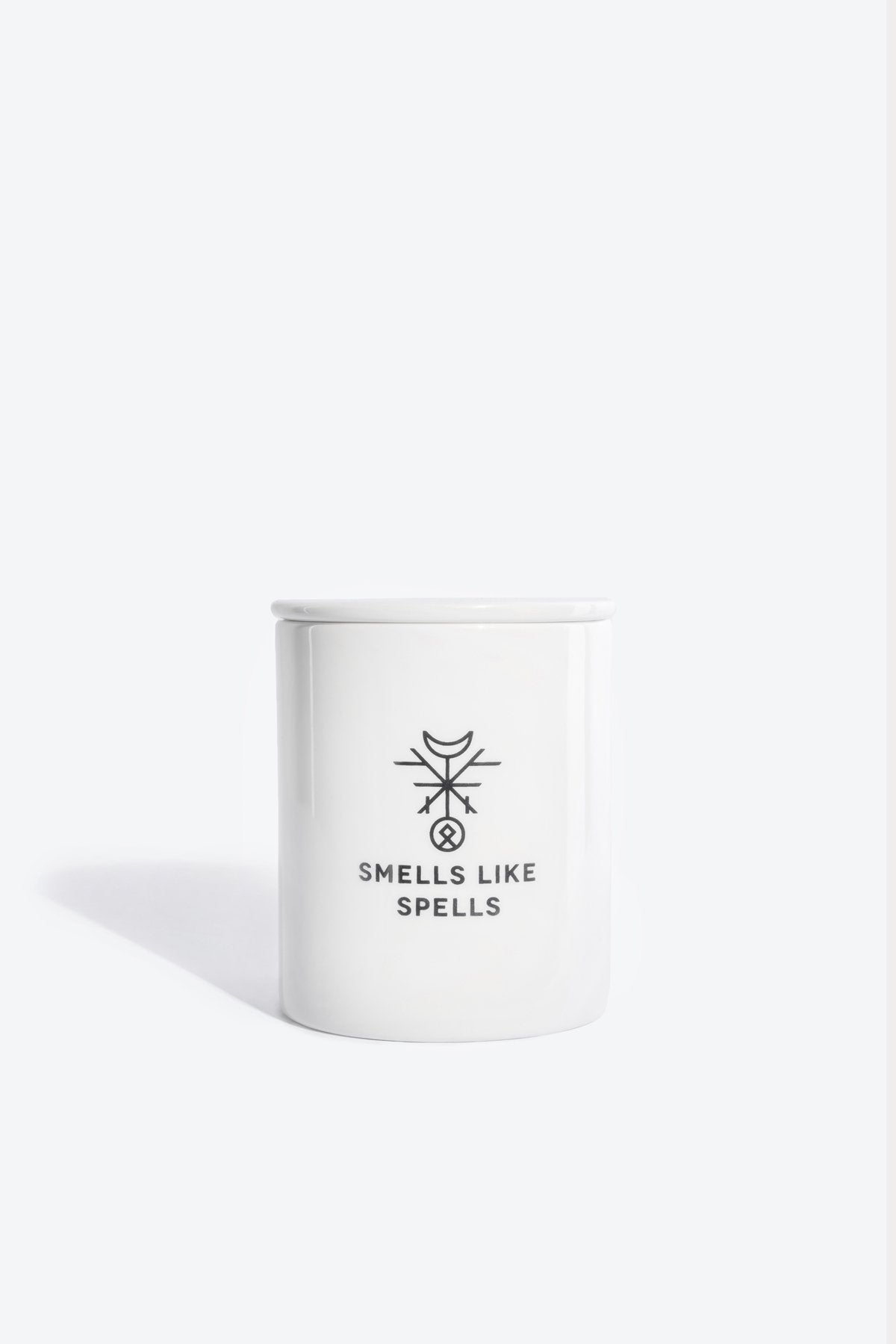 1. Smells Like Spells Scented Candle THE SUN in white porcelain container, studio setting