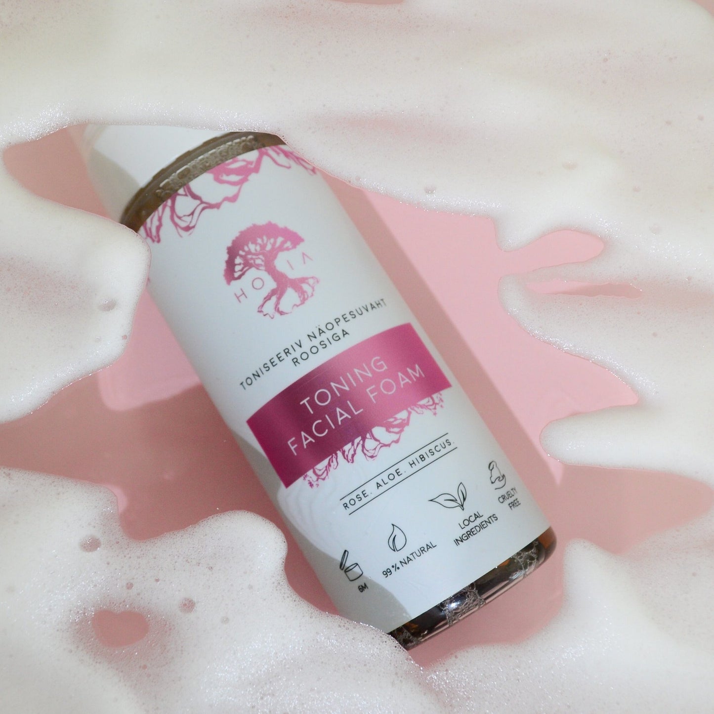 4. HOIA homespa Toning Facial Foam bottle surrounded by foam, close-up