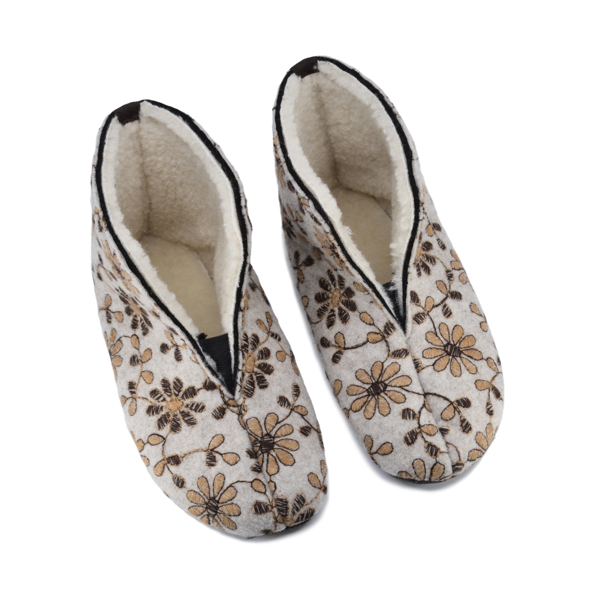 1. Women's natural felt and sheep's wool slippers by Omaking, featuring a floral pattern, shown from above