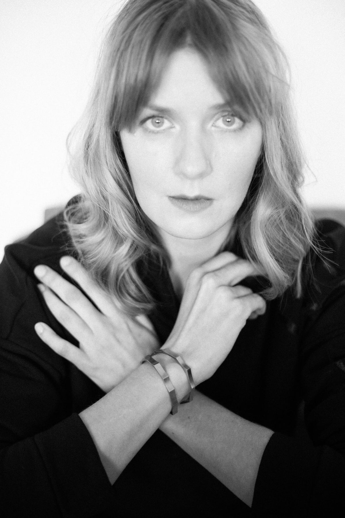 2. Woman posing with Lentsius Solis bracelet, highlighting its distinctive half-matte finish