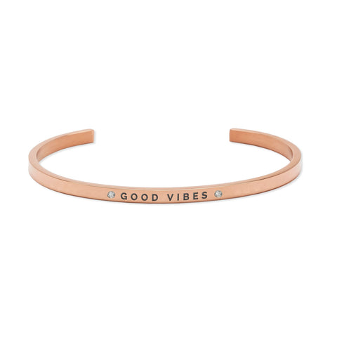 2. Rose gold 'Good Vibes' bracelet by Olla, featuring engraved text and crystal details, displayed in studio setting