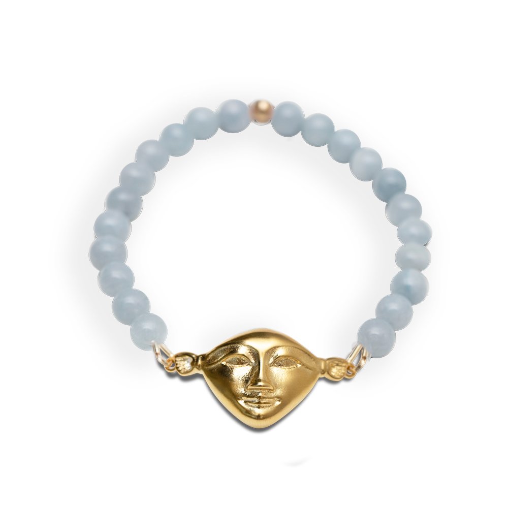 3. Studio image of Hathor Harmony Bracelet in aquamarine and gold-plated silver by New Vintage by Kriss, showing detailed face design