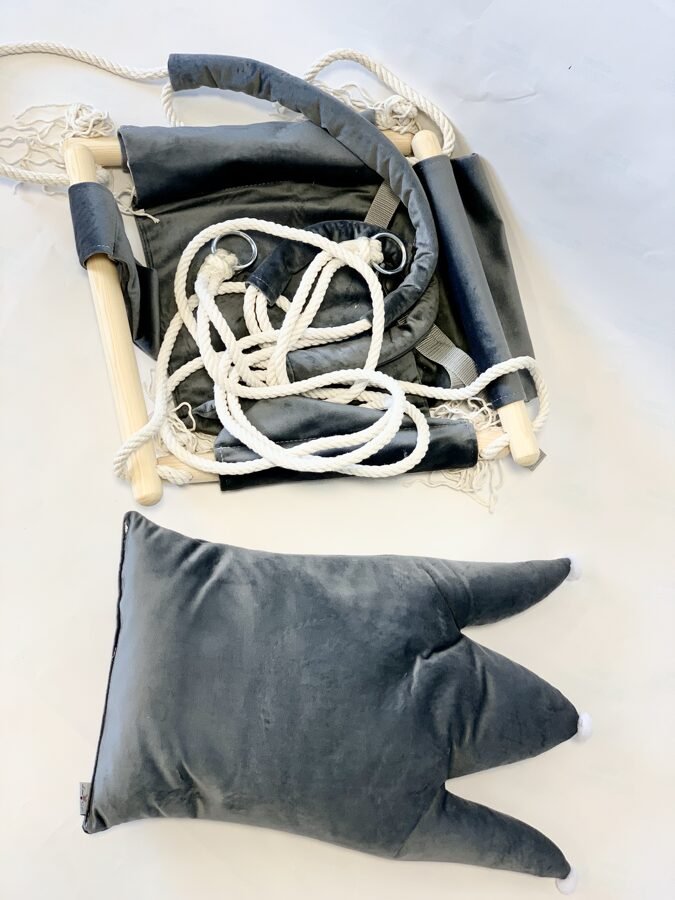 2. Disassembled grey crown-shaped cushion swing with velvet plush material, pinewood parts, and cotton ropes laid out on a white surface