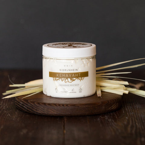 1. HOIA homespa Lemongrass Body Whip 200ML jar on wooden surface with lemongrass, showcasing natural and vegan skincare product