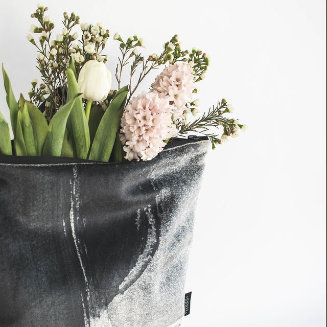 5. Muni Black Watercolor backpack with flowers, showing artistic design