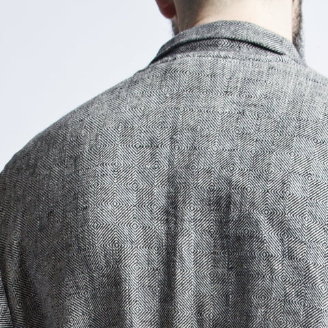 3. Close-up of black fishbone pattern on back of linen bathrobe