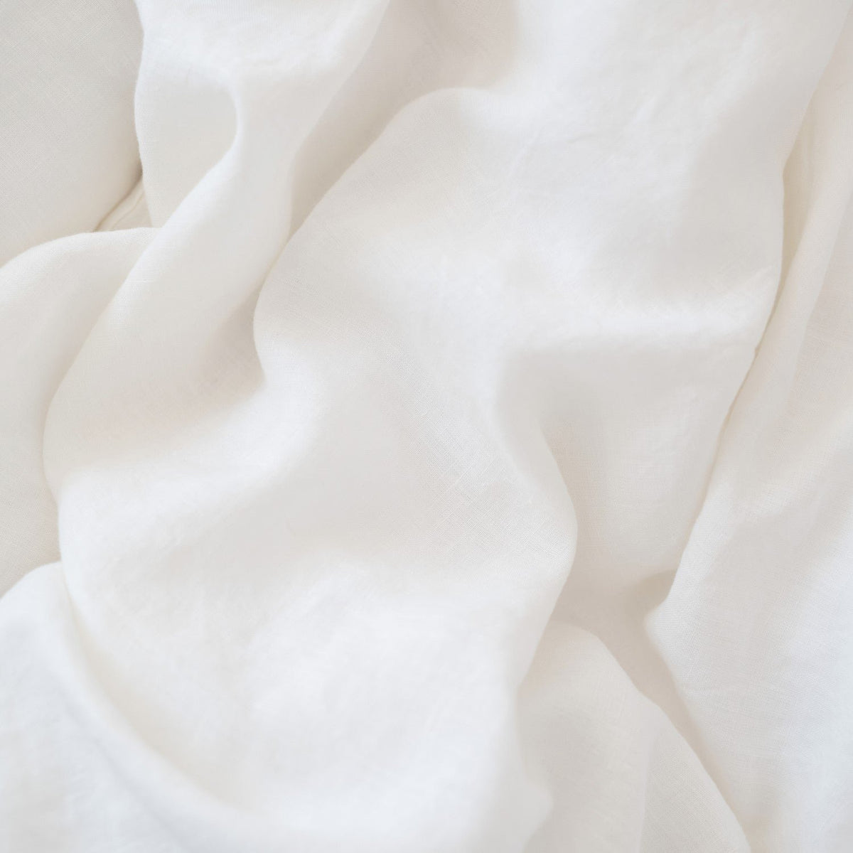 3. Close-up of soft white linen fabric texture