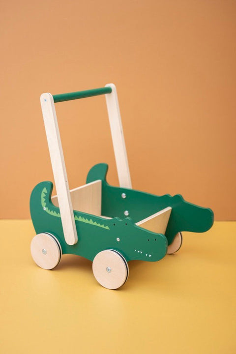 1. Trixie Baby Wooden Cart with crocodile design in green, displayed on a yellow and orange background
