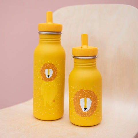 2. Two yellow stainless steel bottles with lion illustrations on wooden chair, showcasing different sizes