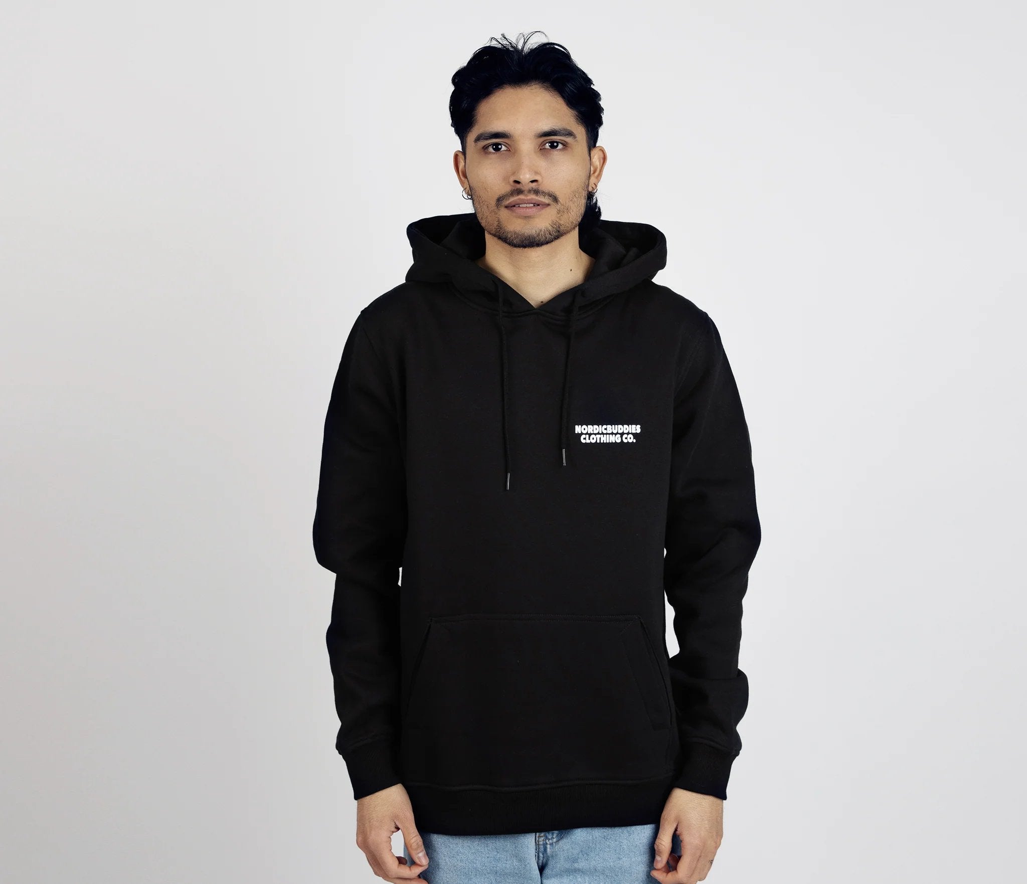 1. Unisex black Moomintroll's Temper Hoodie by NordicBuddies worn by male model in studio