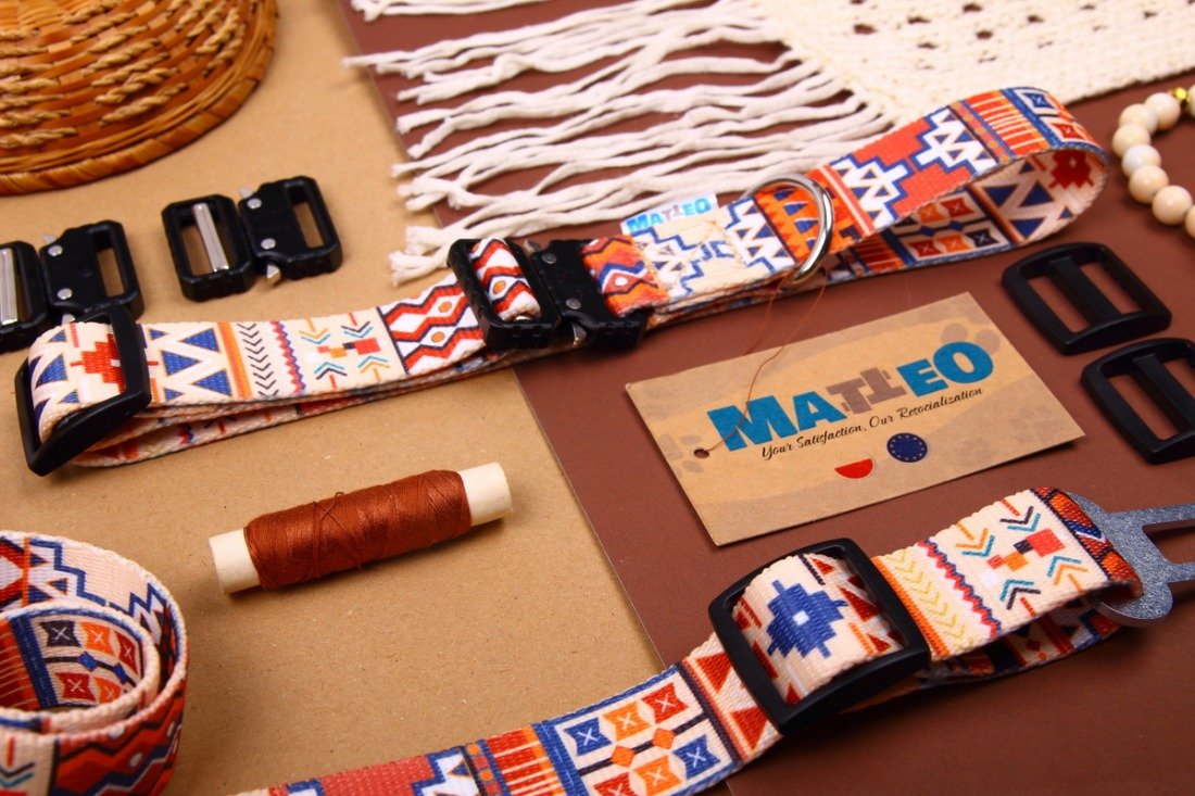4. Flat lay of Matteo boho dog collar with colorful geometric pattern and accessories on brown background