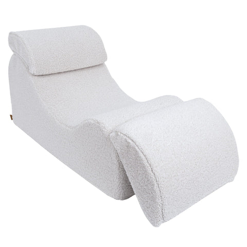 3. White Wave Lounger with footrest partially extended, showcasing its versatility in a studio setting