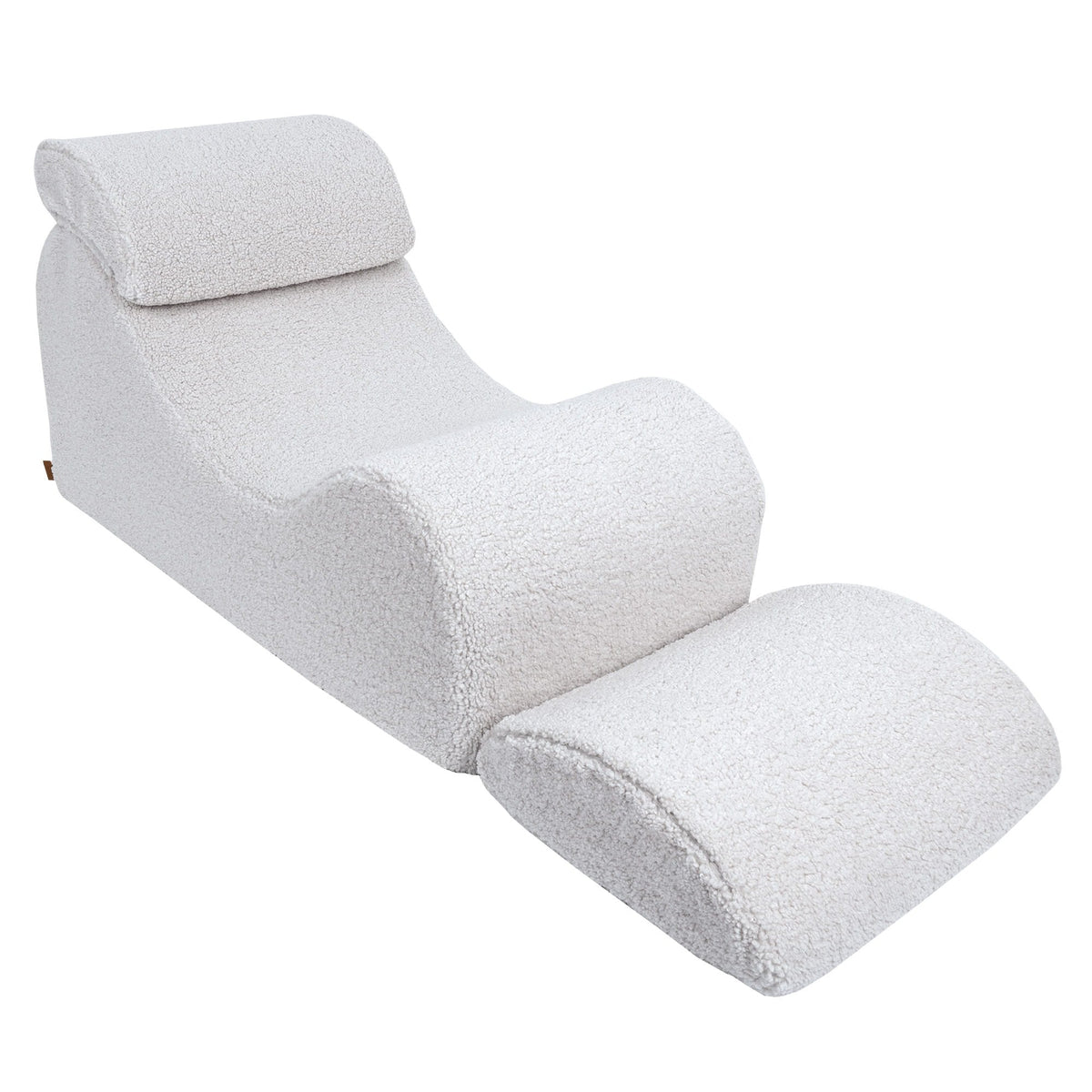 2. White Wave Lounger with extended footrest, highlighting its adjustable feature in a studio setting