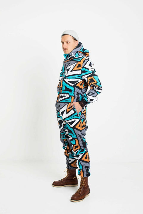 4. Man in Nuckö TANIEL softshell overall with geometric print, side angle, studio background