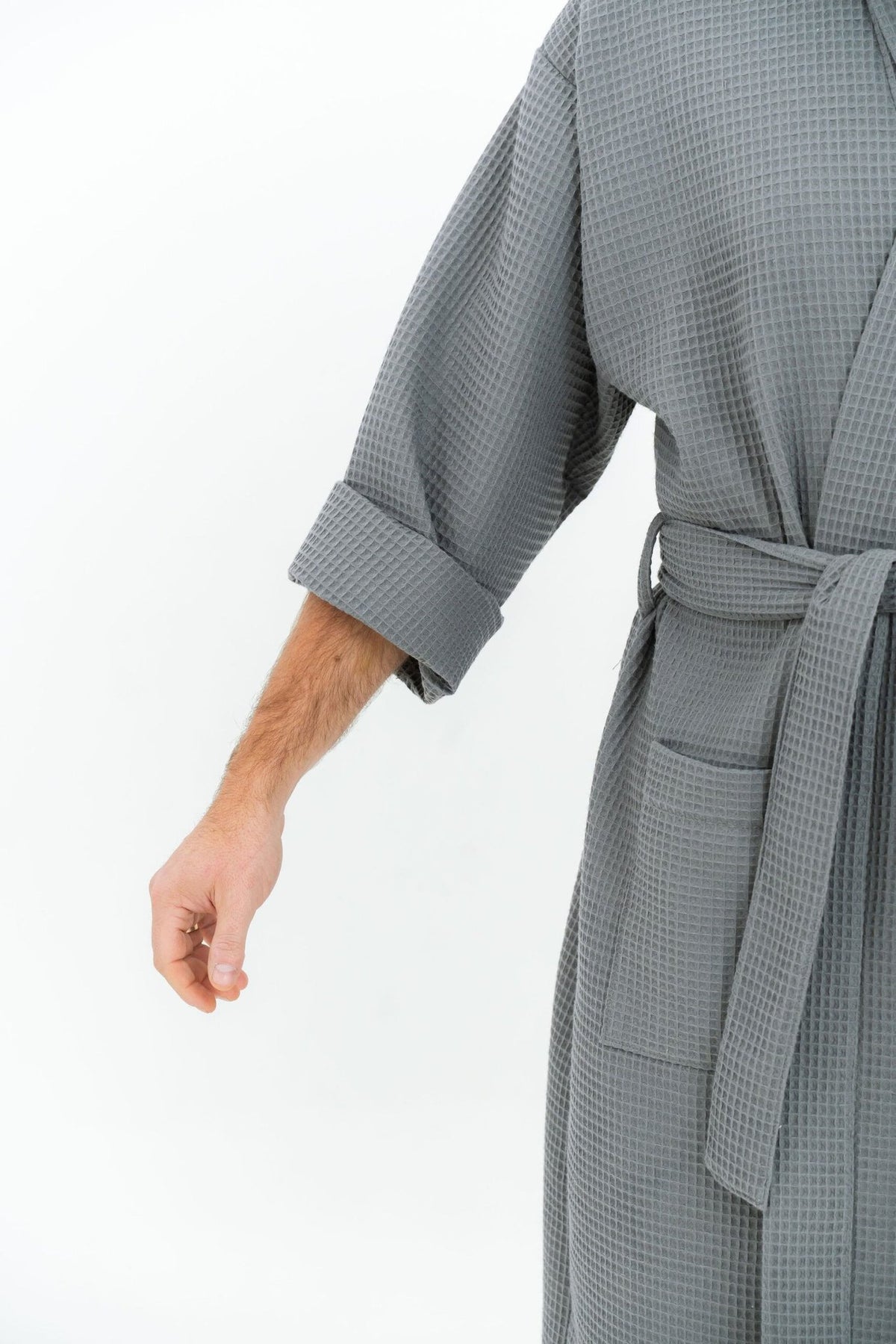 7. Close-up of grey waffle robe showing sleeve and pocket detail