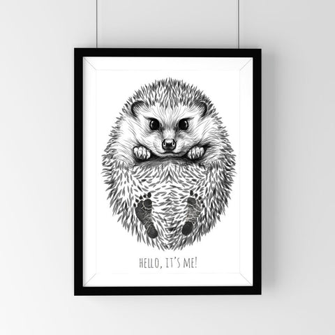 1. Personalized baby hedgehog footprint kit in black frame featuring hand-drawn hedgehog with baby footprints and text 'Hello, it's me!' on white background, ideal for nursery decor.
