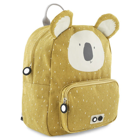 2. Side view of Trixie Baby Mr Koala backpack in mustard yellow with koala face and front pocket, on white background