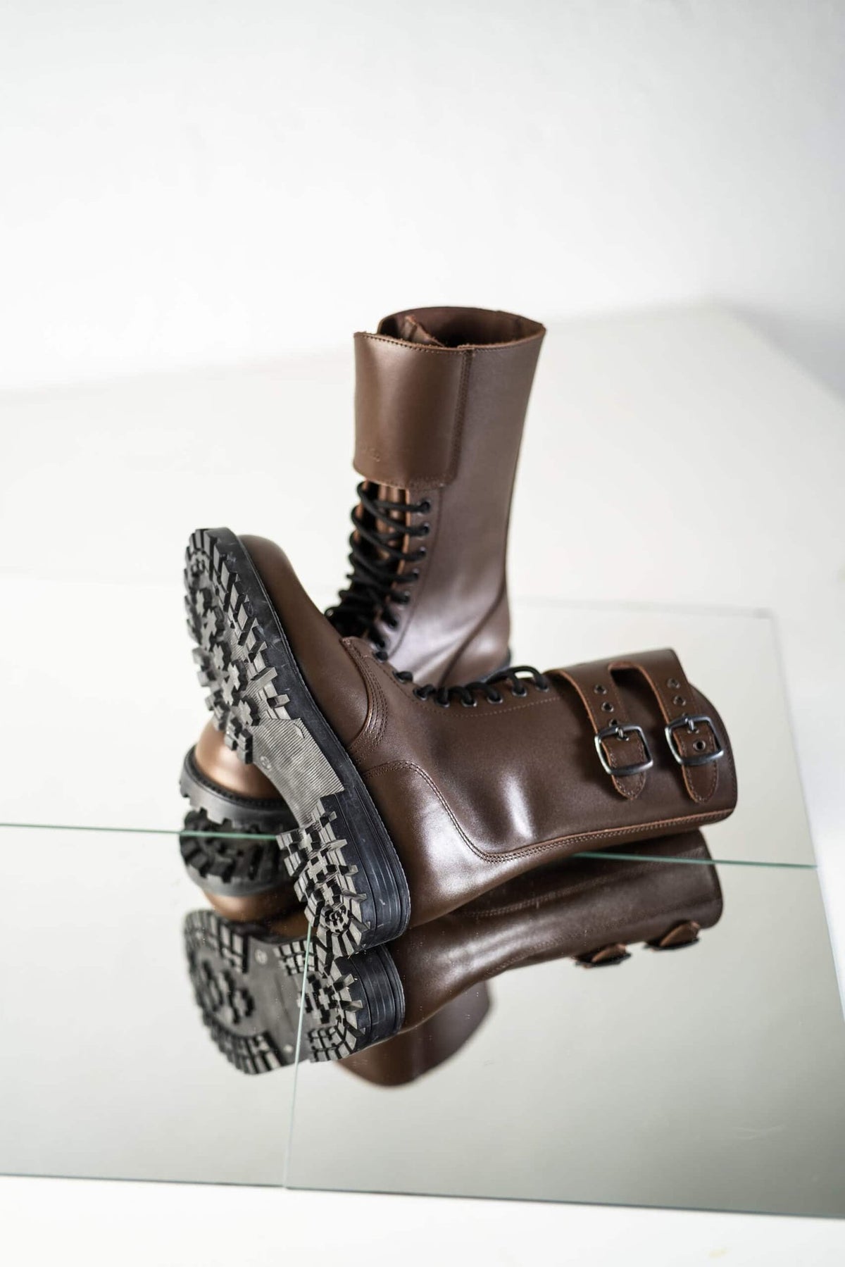 6. Close-up of unisex Tarkovsky Boots in dark brown leather, highlighting sole and buckle detail