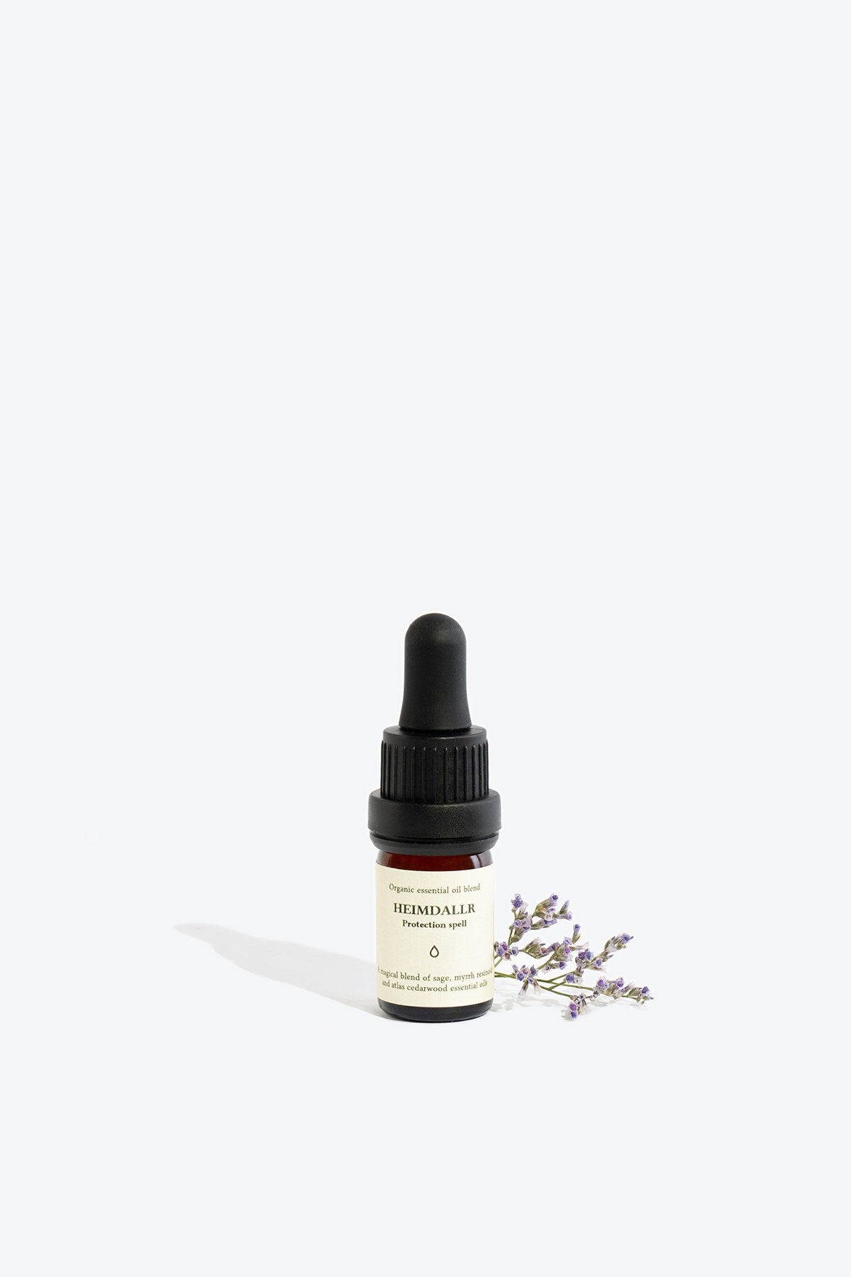 1. Smells Like Spells HEIMDALLR essential oil blend in 5 ml glass bottle with pipette, shown with lavender sprig