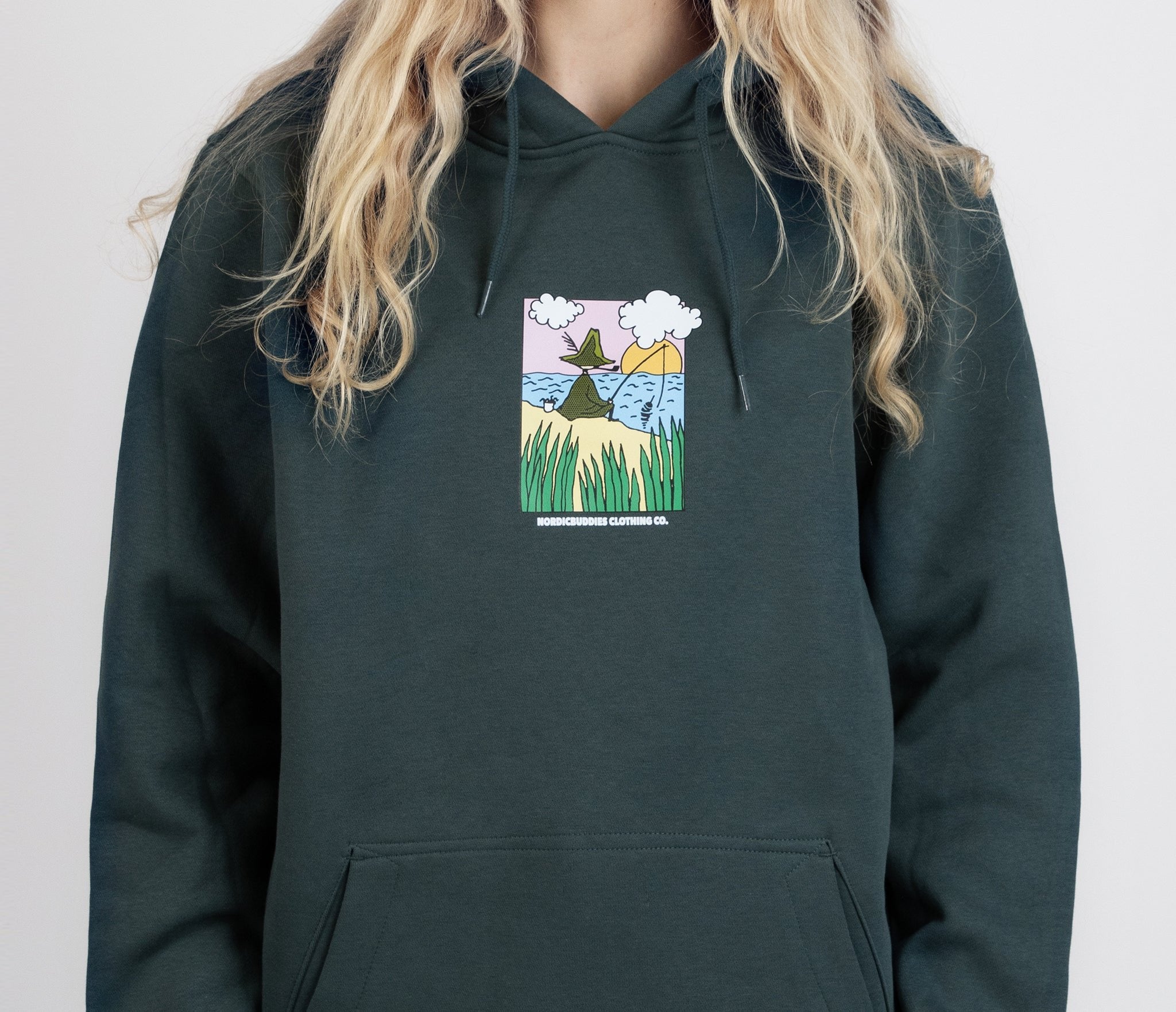 1. Women's dark green Snufkin Fishing Hoodie by Moomin, featuring colorful front graphic, shown in studio