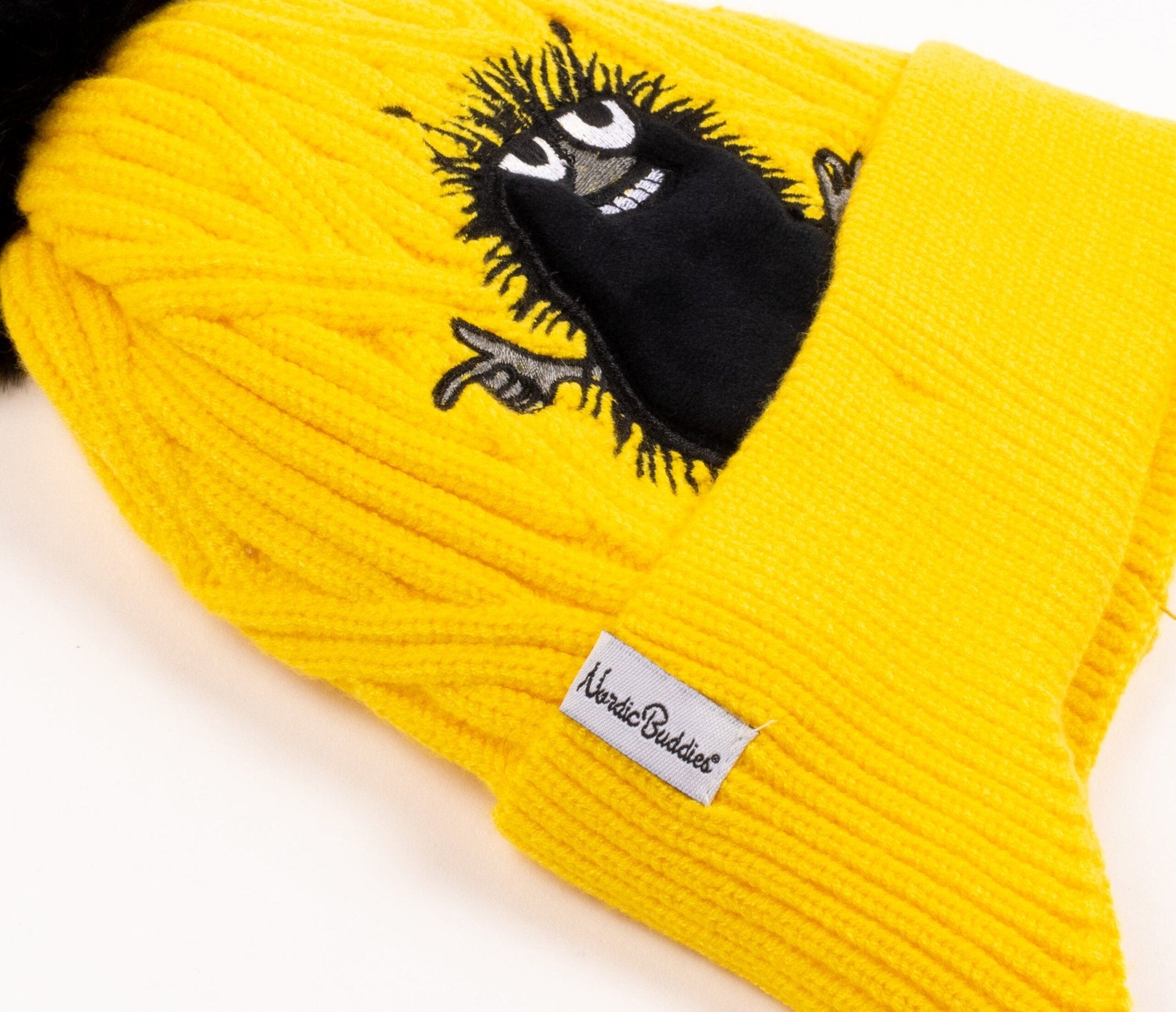 1. Close-up of yellow Stinky Winter Beanie for kids by Moomin, featuring embroidered character and NordicBuddies label