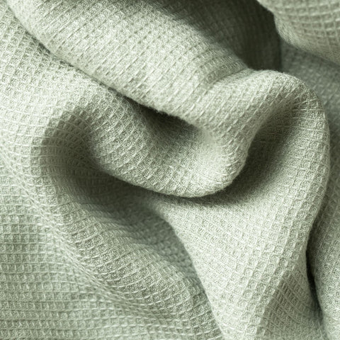 4. Detailed view of sage green waffle linen fabric highlighting texture and weave
