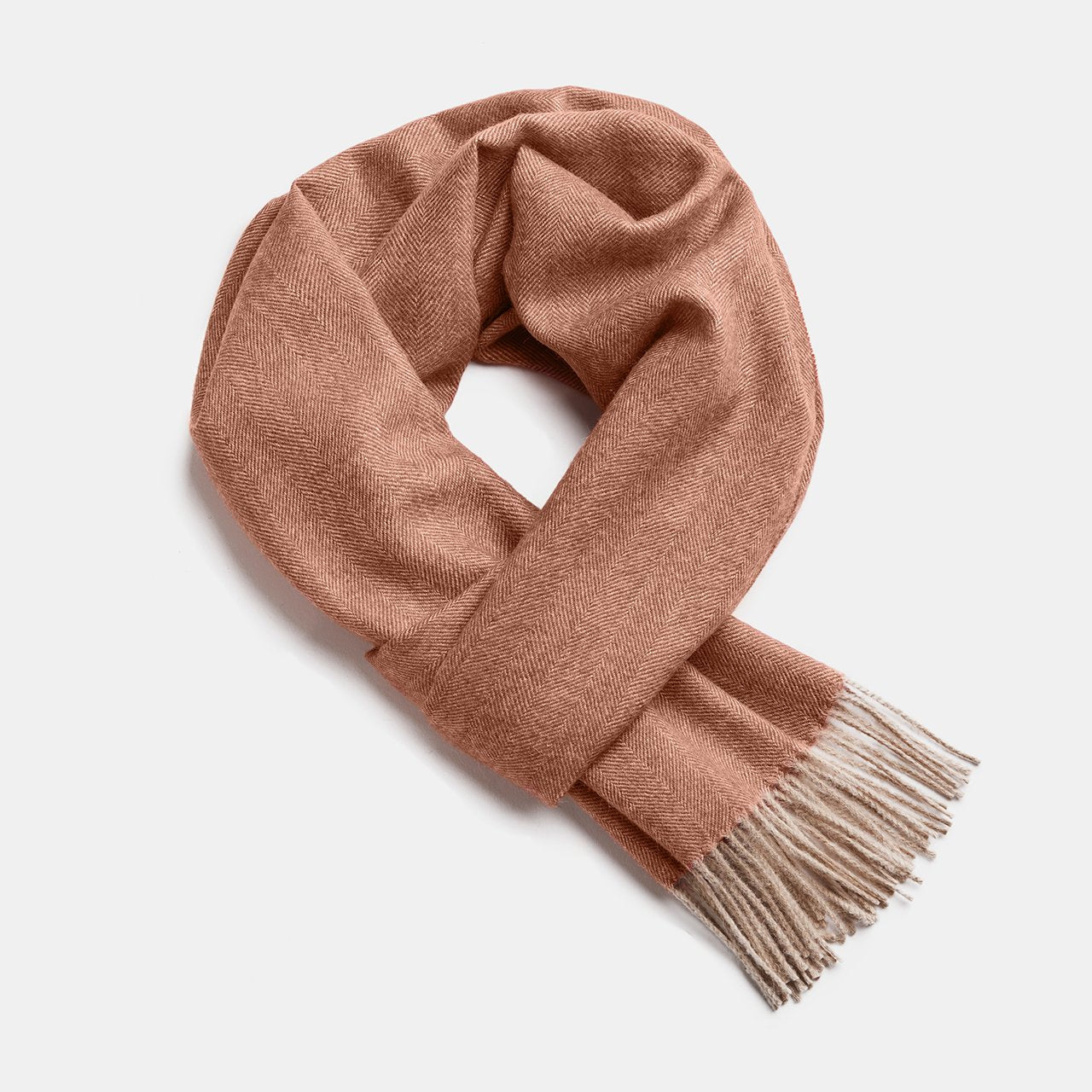 8. Studio image of Alpaka natural baby alpaca wool scarf in peach with fringe detail